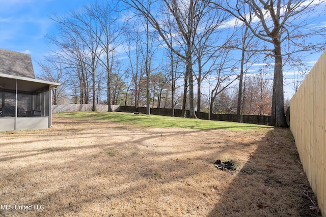 view of yard featuring a sunroom