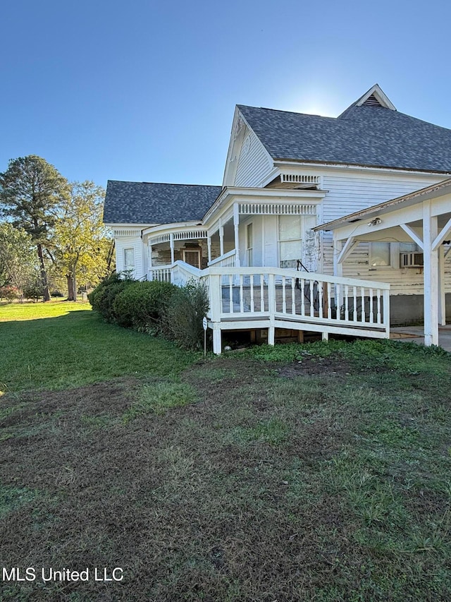 rear view of house with a lawn