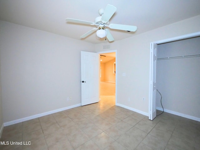 unfurnished bedroom with a closet, visible vents, baseboards, and light tile patterned floors