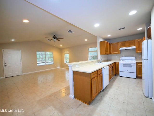 kitchen with white appliances, light countertops, under cabinet range hood, and open floor plan