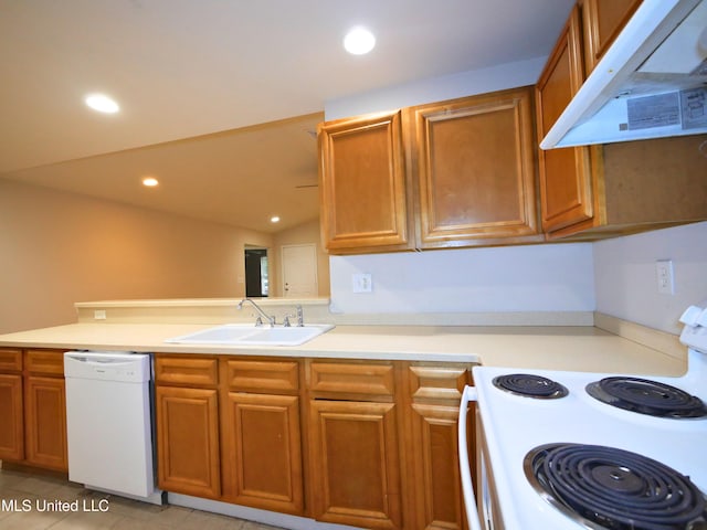 kitchen with white appliances, brown cabinetry, light countertops, under cabinet range hood, and a sink