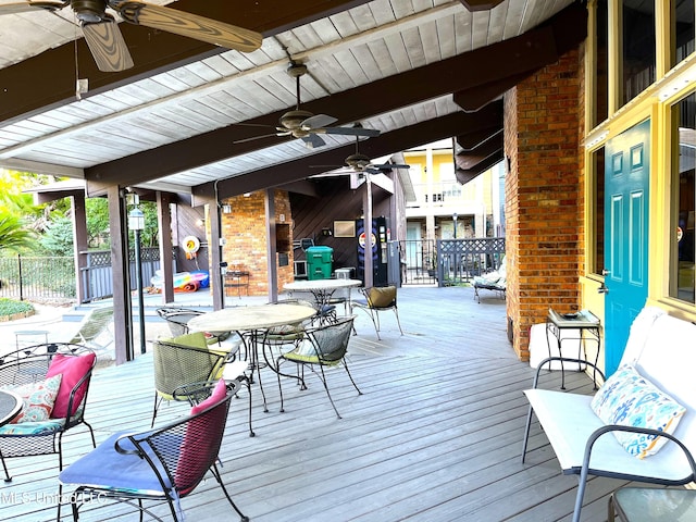 wooden deck featuring ceiling fan