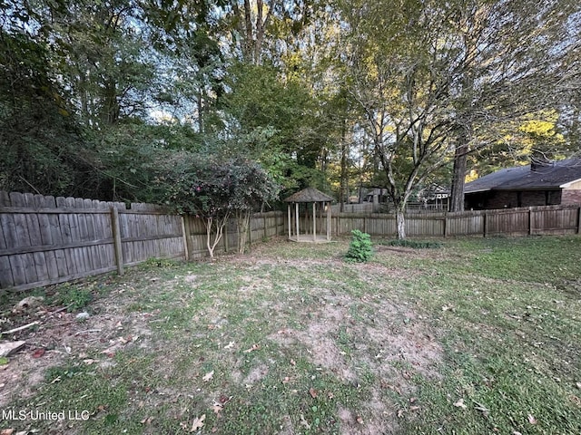 view of yard with a fenced backyard