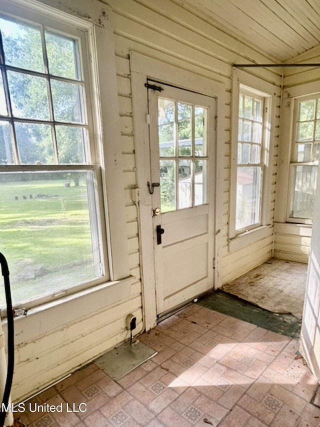 2305 Grenada Blvd, Greenwood, MS 38930 - doorway featuring brick patterned floors and wood walls