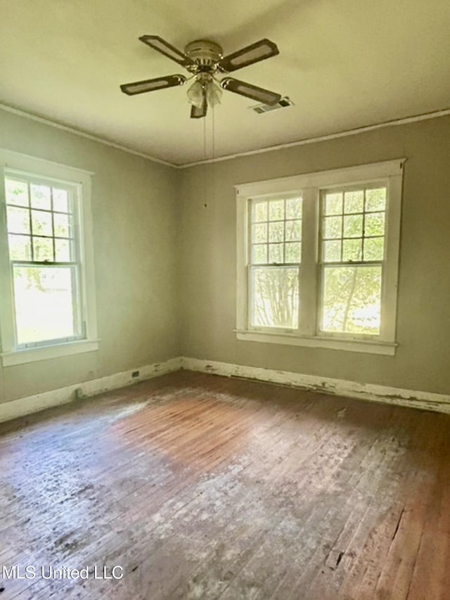 2305 Grenada Blvd, Greenwood, MS 38930 - empty room featuring plenty of natural light, hardwood / wood-style floors, a ceiling fan, and crown molding