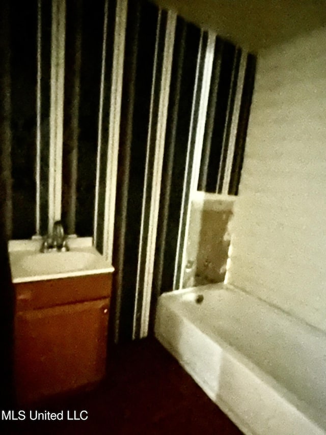 2305 Grenada Blvd, Greenwood, MS 38930 - bathroom with vanity and a tub to relax in