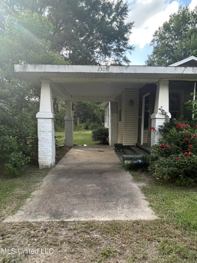 2305 Grenada Blvd, Greenwood, MS 38930 - view of vehicle parking featuring an attached carport