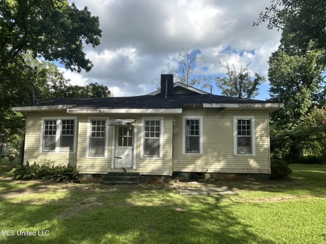 2305 Grenada Blvd, Greenwood, MS 38930 - rear view of house with a lawn and entry steps