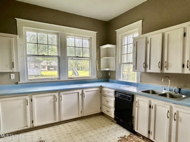 2305 Grenada Blvd, Greenwood, MS 38930 - kitchen with dishwasher, light flooring, white cabinets, open shelves, and light countertops