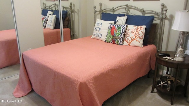 carpeted bedroom featuring a closet