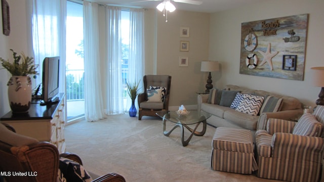 living room with light colored carpet and ceiling fan