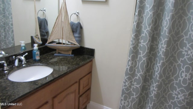 bathroom featuring vanity and a shower with curtain