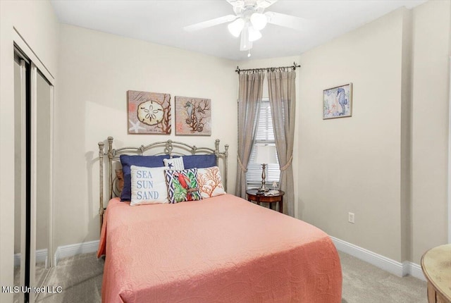 bedroom featuring a closet, light carpet, and ceiling fan