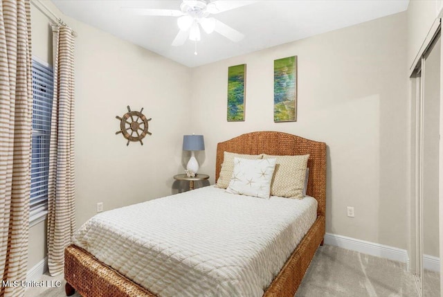 carpeted bedroom featuring ceiling fan