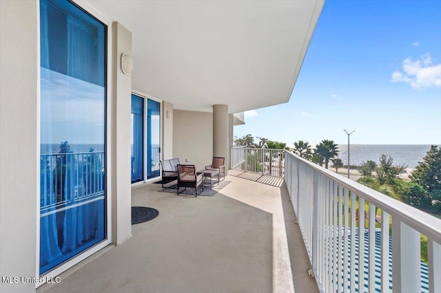 balcony featuring a water view