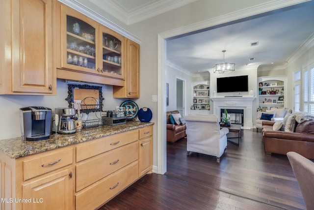 2011 Pointe Clear Dr, Biloxi, MS 39531 - kitchen with light brown cabinetry, dark wood-style flooring, glass insert cabinets, light stone countertops, and crown molding