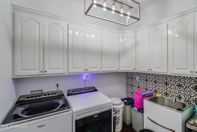 2011 Pointe Clear Dr, Biloxi, MS 39531 - clothes washing area with washer and clothes dryer and cabinet space