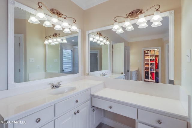 2011 Pointe Clear Dr, Biloxi, MS 39531 - bathroom with vanity, ornamental molding, and a walk in closet