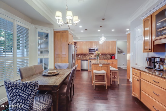 2011 Pointe Clear Dr, Biloxi, MS 39531 - dining area featuring ornamental molding, a chandelier, dark wood finished floors, recessed lighting, and baseboards