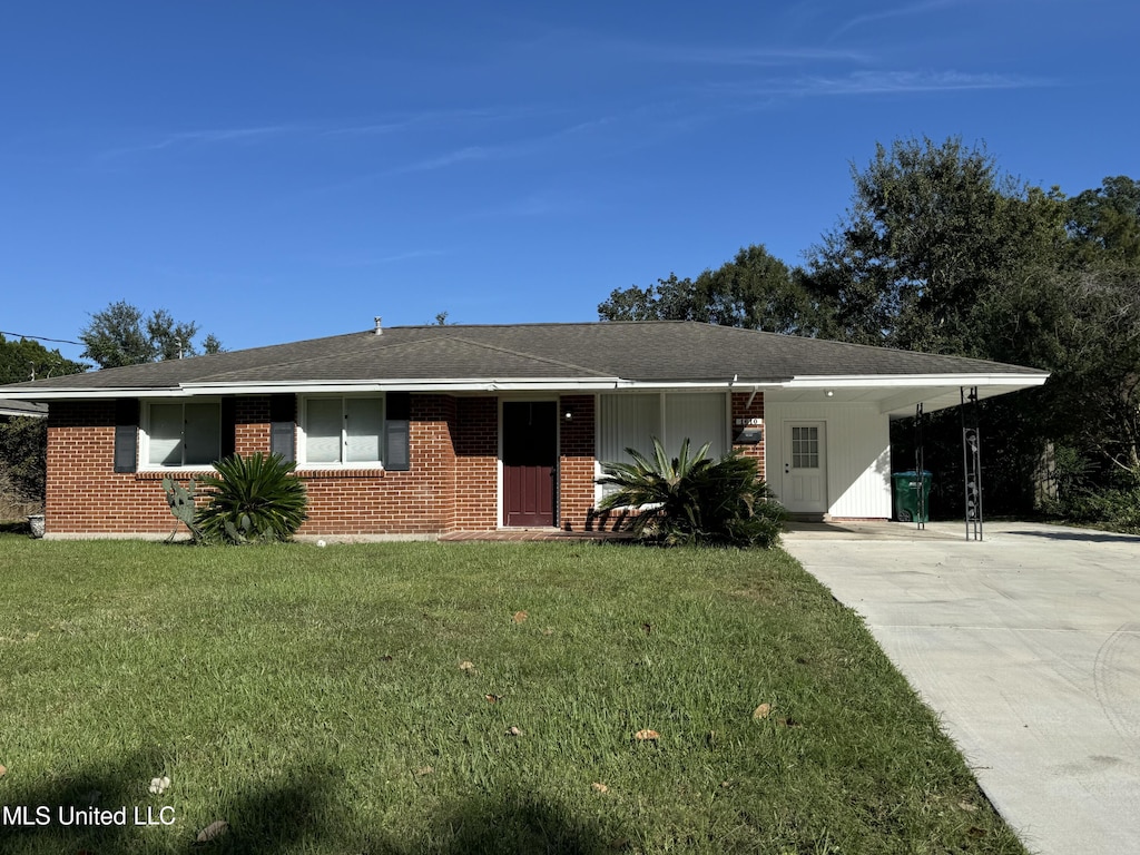 single story home with a carport and a front yard