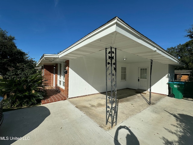 exterior space featuring a carport