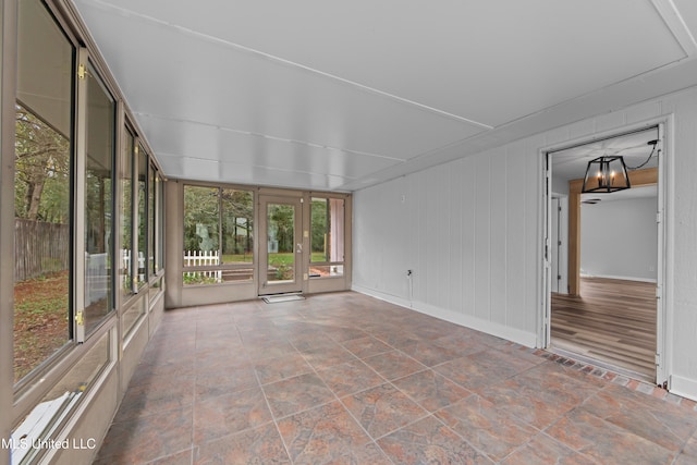 unfurnished sunroom featuring a healthy amount of sunlight