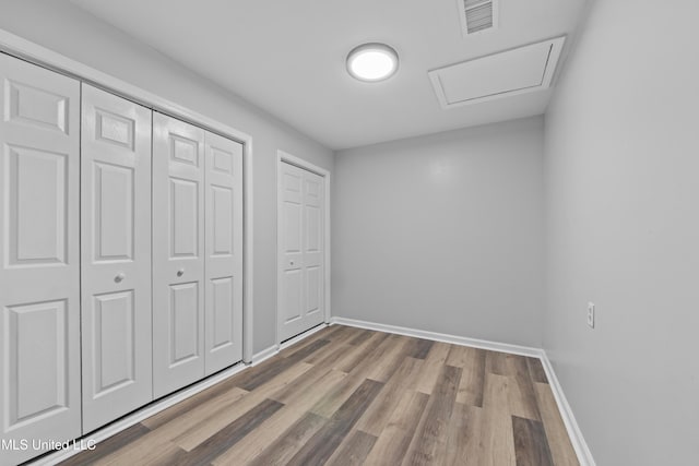 unfurnished bedroom featuring hardwood / wood-style floors