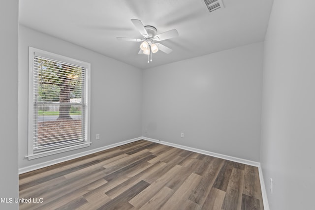 spare room featuring ceiling fan and wood-type flooring