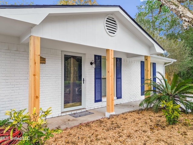 entrance to property with a porch