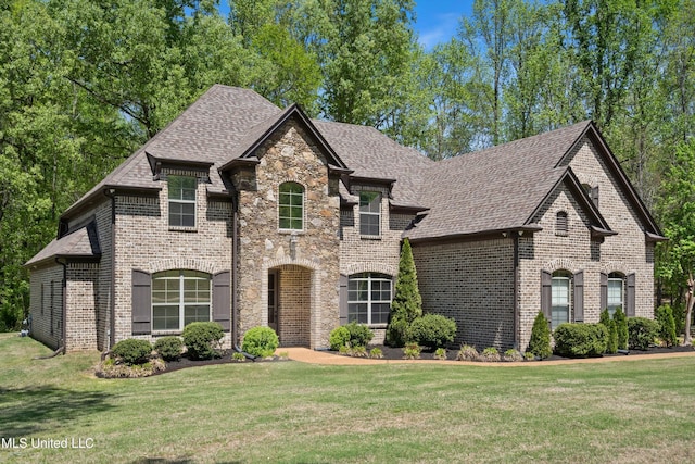 8240 Steven Henry Rd, Hernando, MS 38632 - french country inspired facade featuring a front lawn, roof with shingles, and brick siding