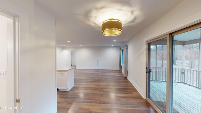 hallway featuring dark hardwood / wood-style flooring