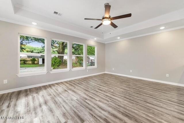 105 Leigh Cir, Ocean Springs, MS 39564 - spare room with a tray ceiling, crown molding, plenty of natural light, recessed lighting, and ceiling fan