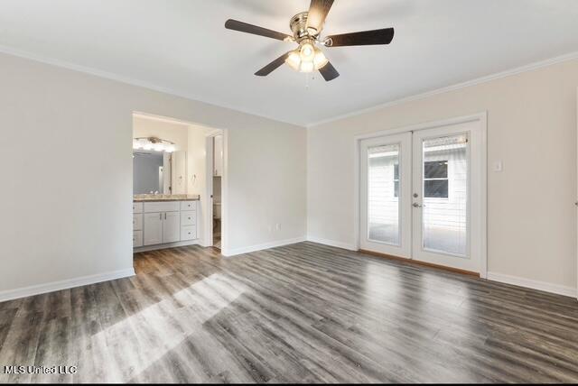 105 Leigh Cir, Ocean Springs, MS 39564 - empty room featuring french doors, wood finished floors, ornamental molding, and ceiling fan