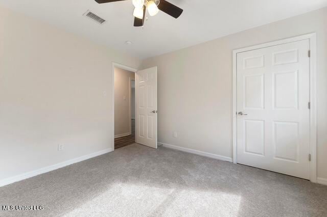 105 Leigh Cir, Ocean Springs, MS 39564 - unfurnished bedroom with carpet and a ceiling fan