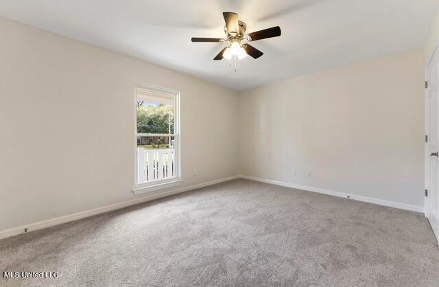 105 Leigh Cir, Ocean Springs, MS 39564 - empty room featuring carpet floors and a ceiling fan