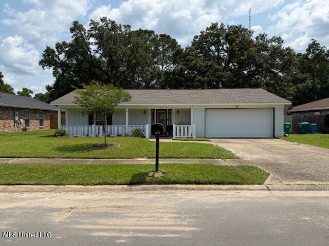 105 Leigh Cir, Ocean Springs, MS 39564 - ranch-style home featuring an attached garage, driveway, a front lawn, and a porch