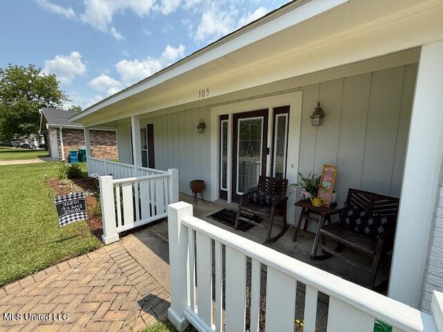 105 Leigh Cir, Ocean Springs, MS 39564 - view of exterior entry with a porch