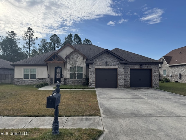 view of front of home featuring a front lawn and a garage