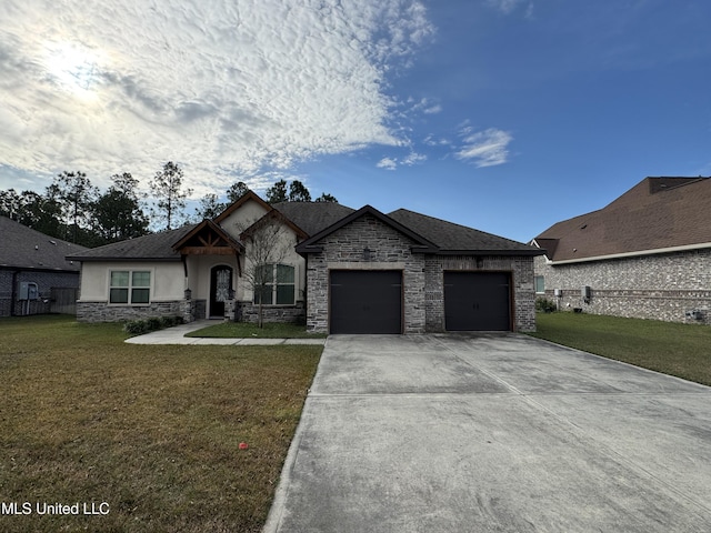 view of front of home with a garage and a front yard