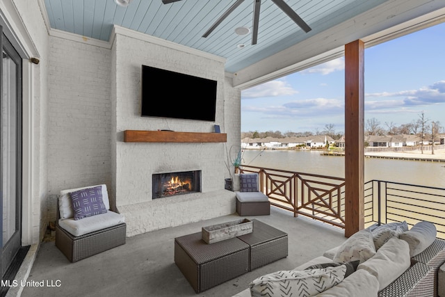 view of patio with an outdoor living space with a fireplace