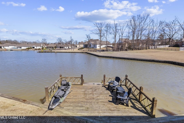 dock area featuring a water view and a residential view