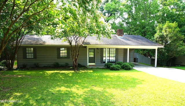 116 Victoria Cir, Newton, MS 39345 - single story home featuring concrete driveway, a chimney, a carport, and a front lawn