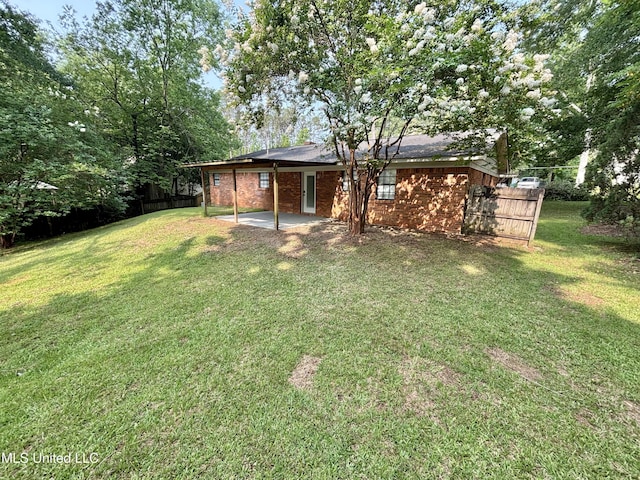 116 Victoria Cir, Newton, MS 39345 - back of house featuring a patio, brick siding, and an attached carport