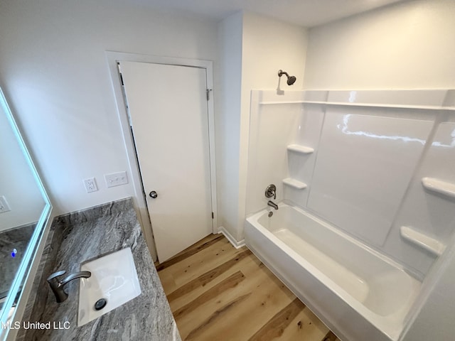 116 Victoria Cir, Newton, MS 39345 - bathroom with wood finished floors, washtub / shower combination, and vanity