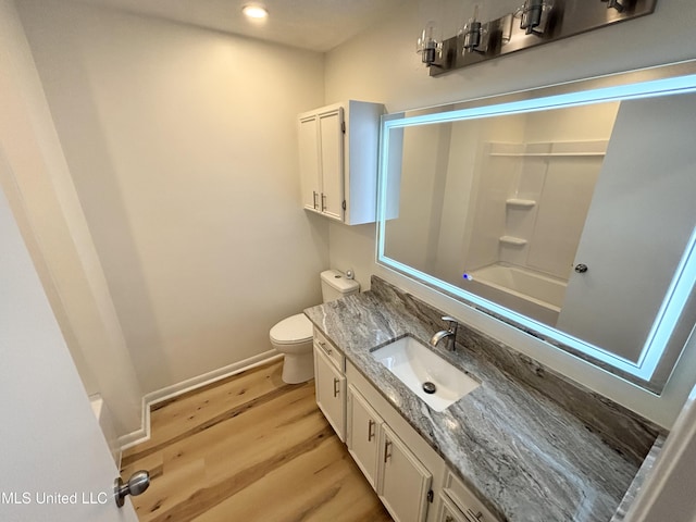 116 Victoria Cir, Newton, MS 39345 - bathroom with vanity, toilet, wood finished floors, baseboards, and recessed lighting