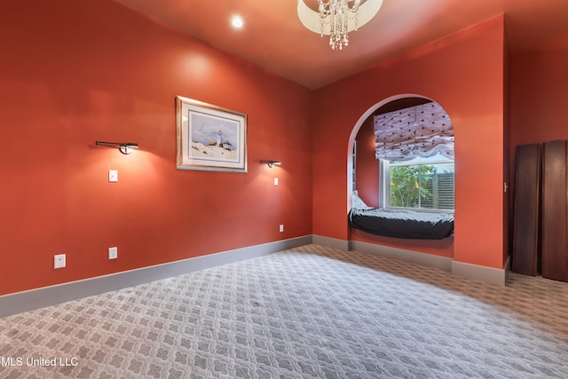 interior space with carpet and a notable chandelier