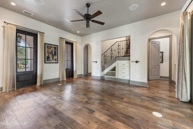 interior space with ceiling fan and dark hardwood / wood-style floors