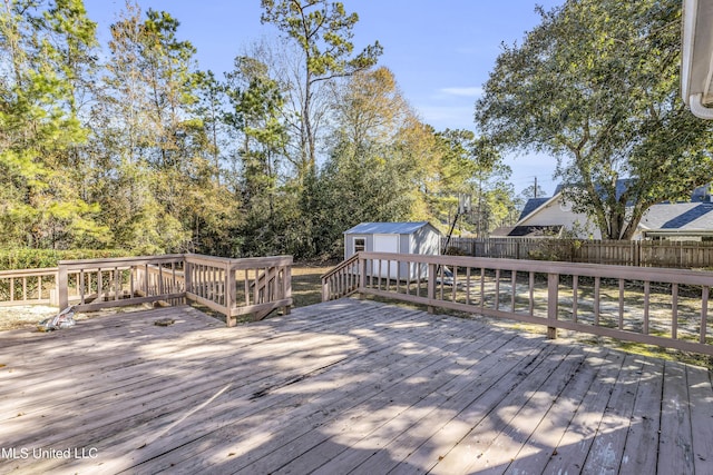 wooden deck with a storage shed