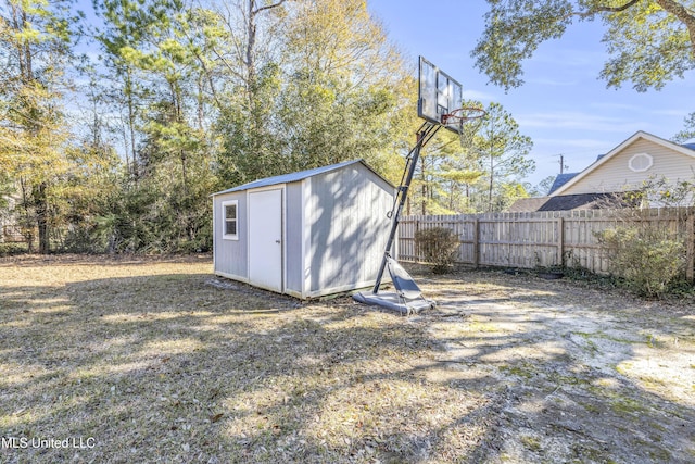 view of outbuilding with a yard