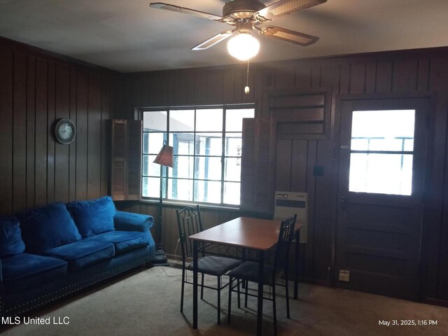 751 Dorgan St, Jackson, MS 39204 - dining room featuring plenty of natural light, wood walls, carpet floors, ceiling fan, and heating unit